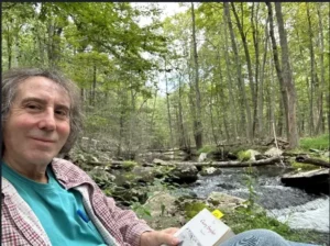 Reading by the stream in his 